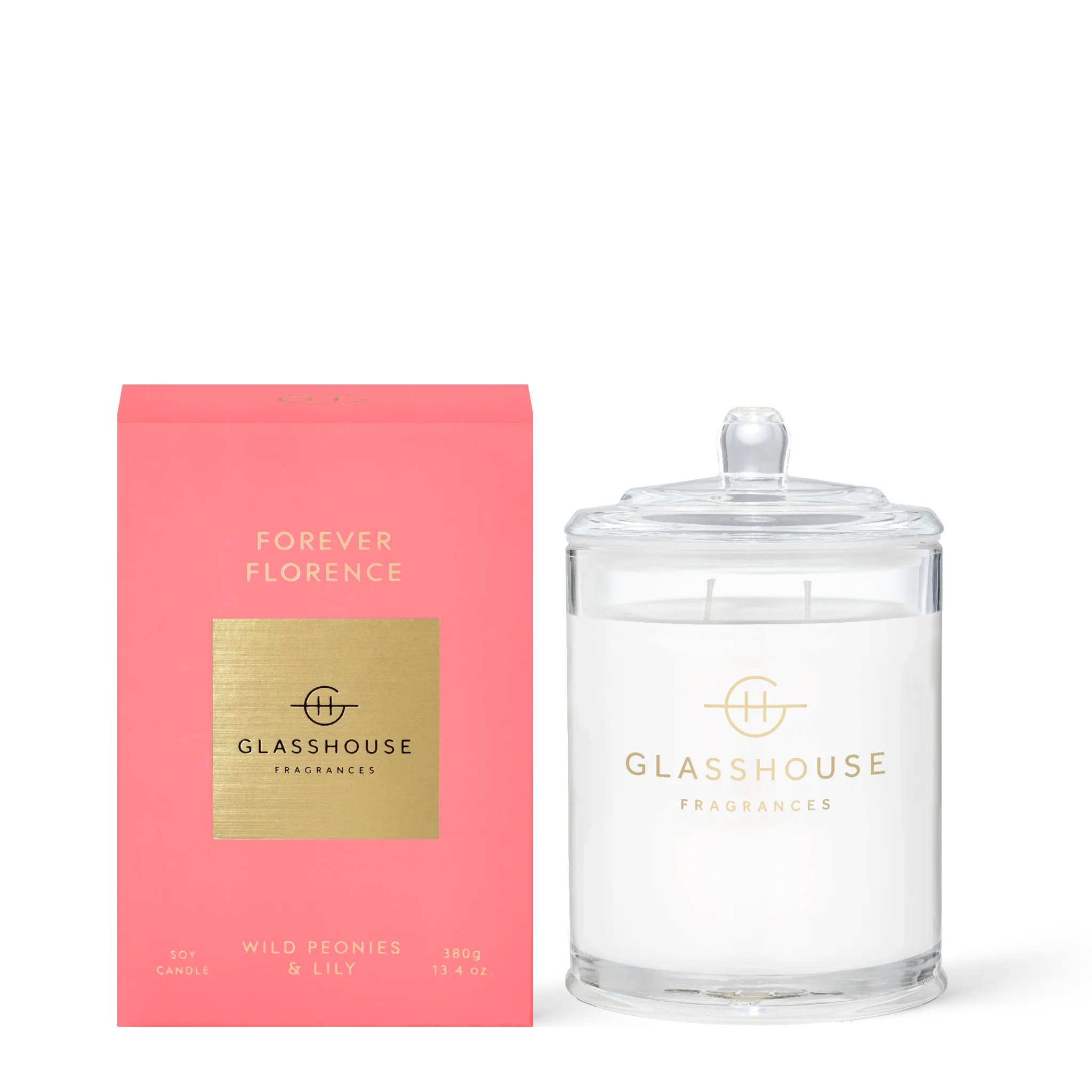 Forever Florence soy candle by Glasshouse Fragrances in a 380g glass container, with a lit wick and a floral scent.