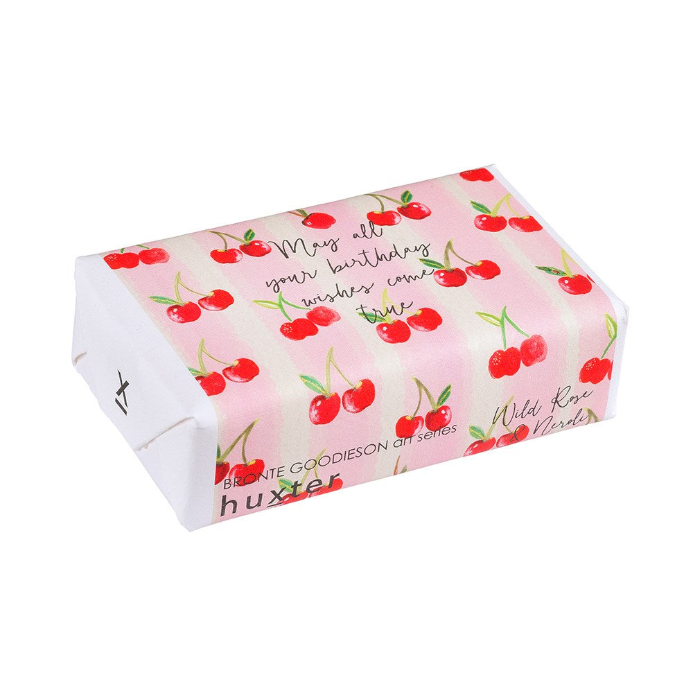 Cherry Stripe Birthday Soap by Huxter featuring wild neroli and rose, with vibrant cherry stripe design and floral accents.