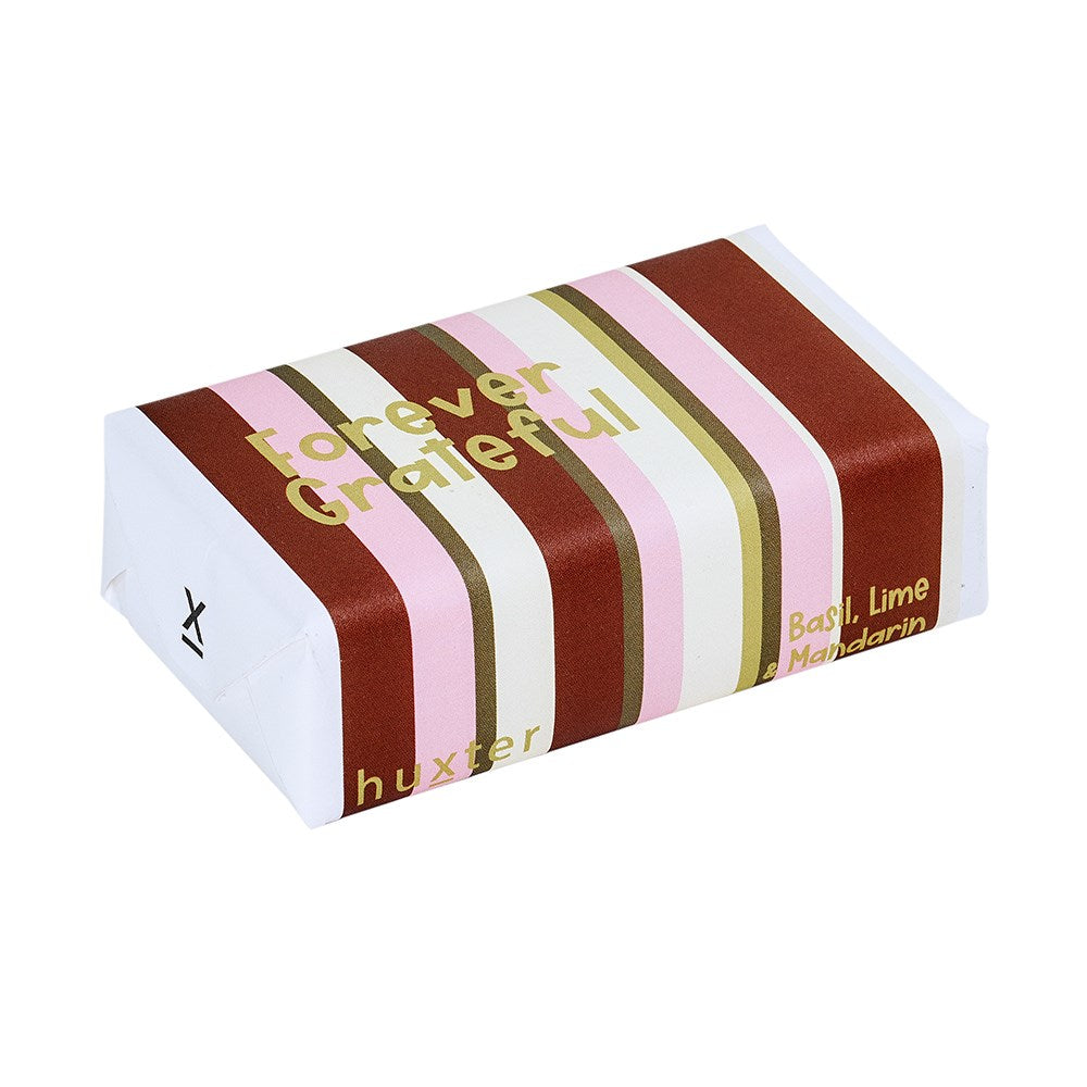 Huxter Forever Grateful soap with basil, lime, and mandarin scents, featuring a fresh, natural soap bar with botanical ingredients.
