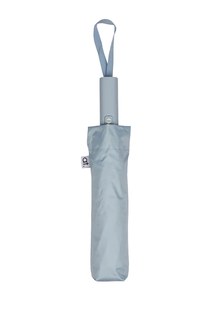 Annabel Trends compact auto open and close umbrella with black canopy and ergonomic handle, ready for rainy weather.
