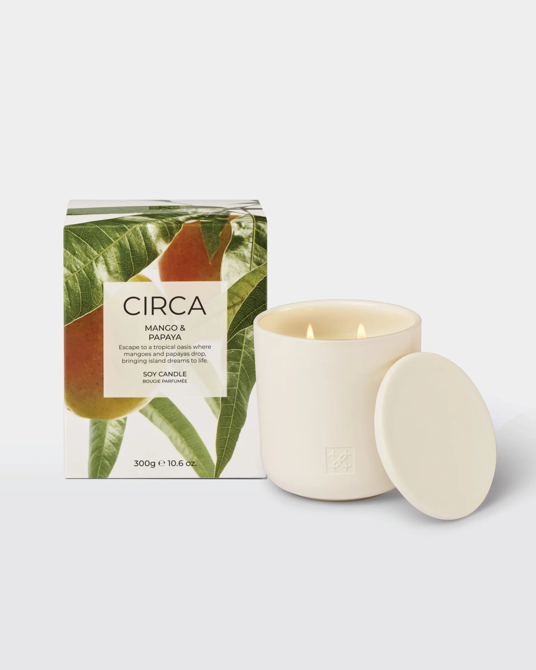 Circa Mango & Papaya soy candle in a 300g jar, showcasing the vibrant fruit-inspired design and warm, inviting glow.