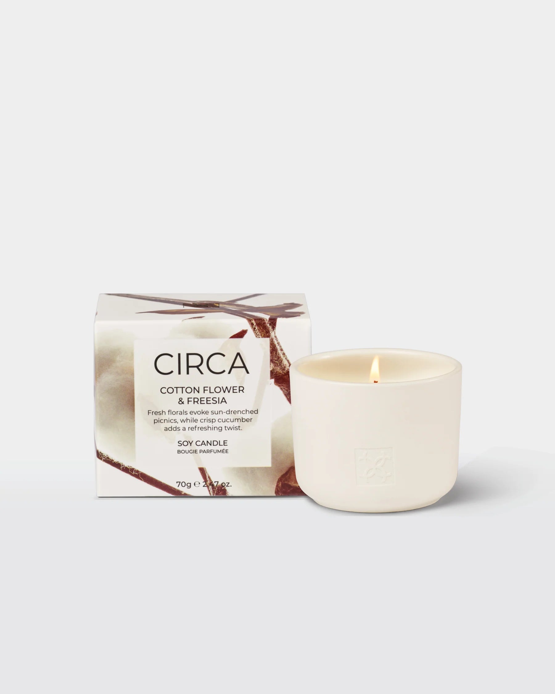 Soy candle in a glass jar with cotton flower and freesia scent, 300g from Circa featuring floral accents and a clean design.