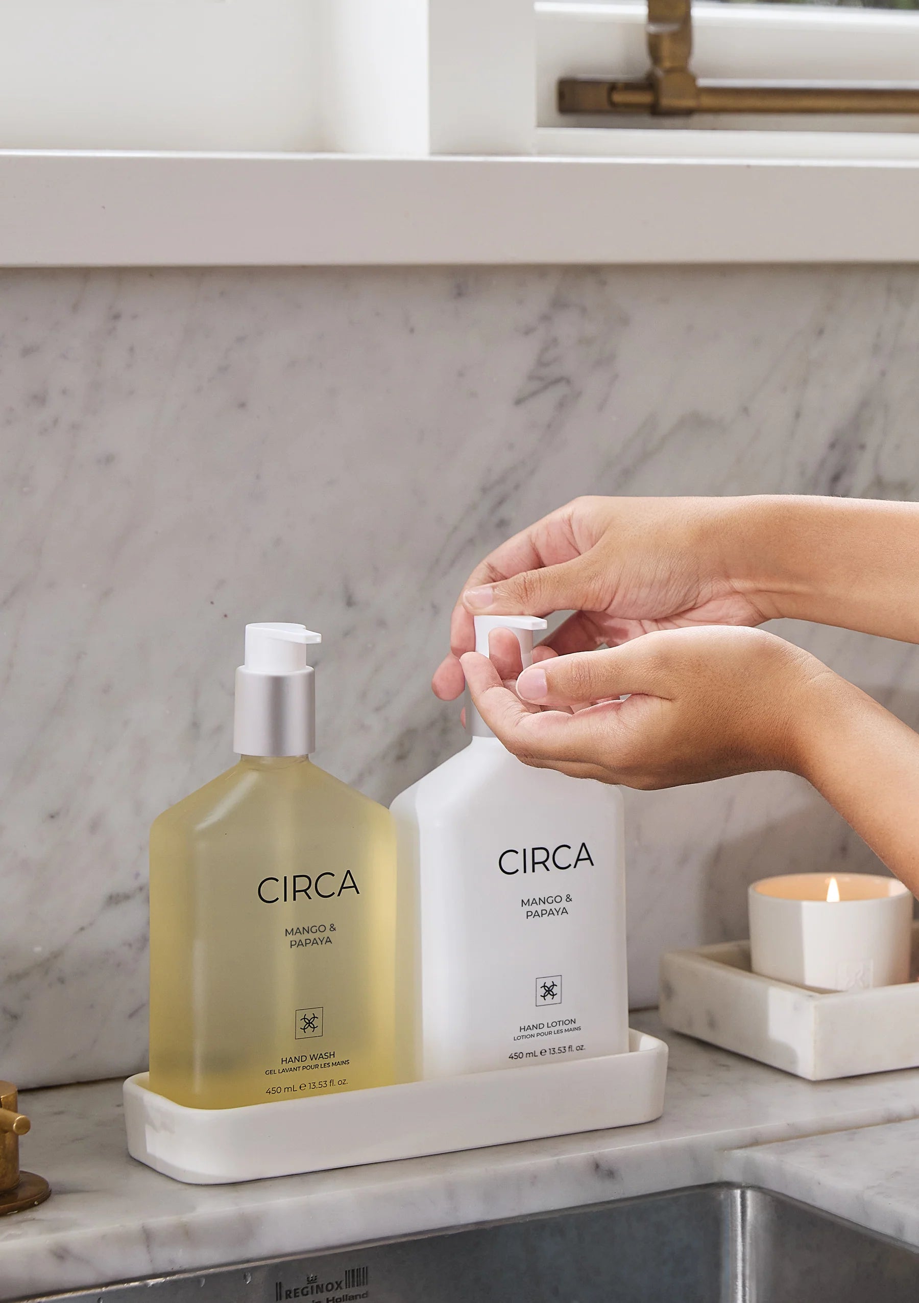 CIrca Mango & Papaya Hand Lotion 450ml with moisturizing formula and tropical fruit scent, displayed in a clear bottle.