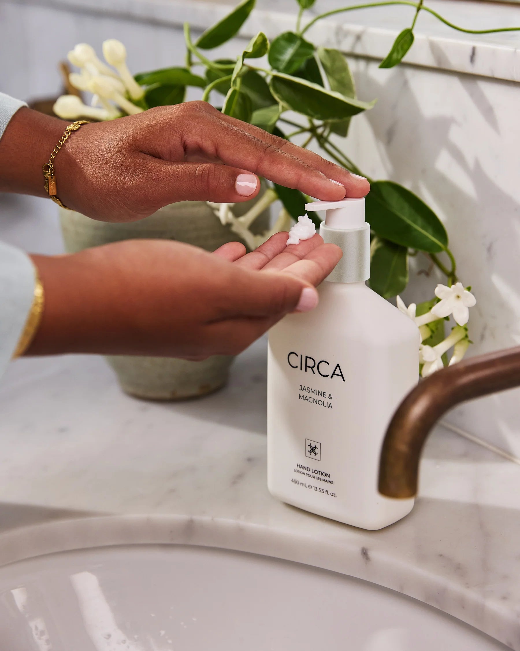 CIrca Jasmine & Magnolia hand lotion in a 450ml bottle, featuring a floral design and smooth, moisturizing lotion.