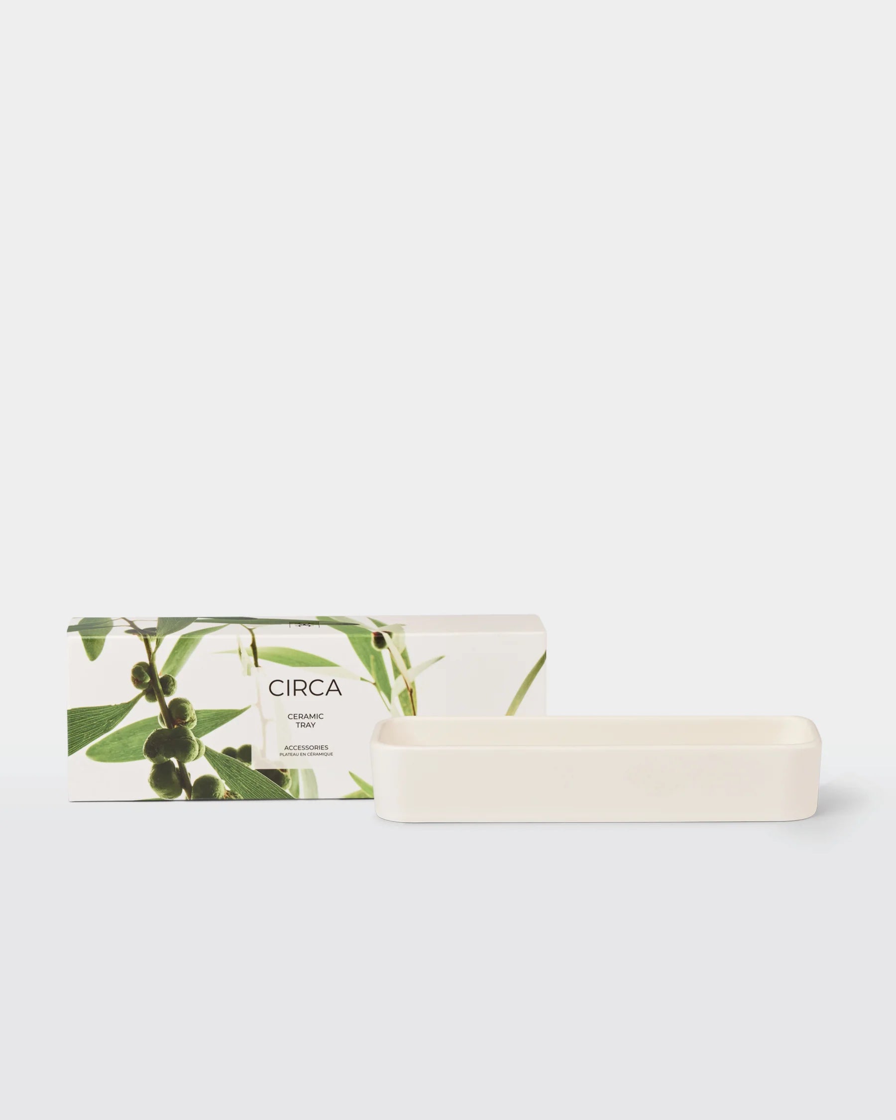 Ceramic tray accessory by Circa, featuring a smooth, oval-shaped surface ideal for holding small items or decorative pieces.