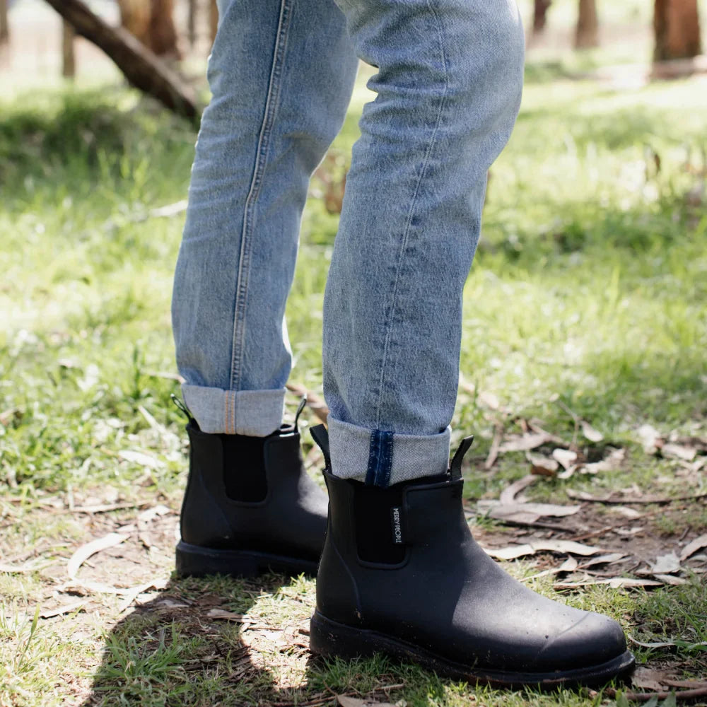Black Bobbi ankle boot by Merry People, featuring sleek black leather with stylish ankle height and modern design.