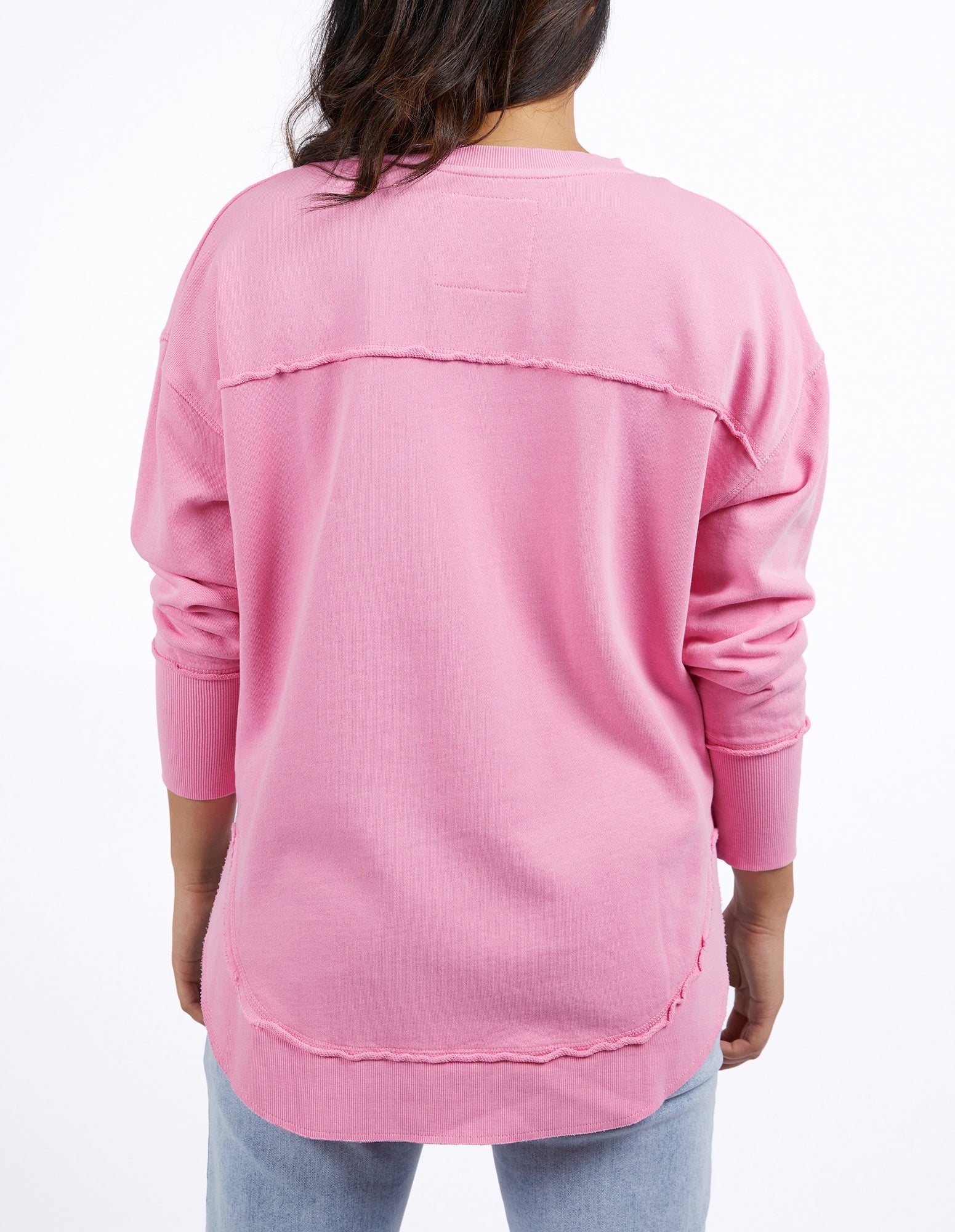 Foxwood Simplified Crew Bubblegum Pink sweatshirt with a relaxed fit and soft fabric, displayed on a hanger.