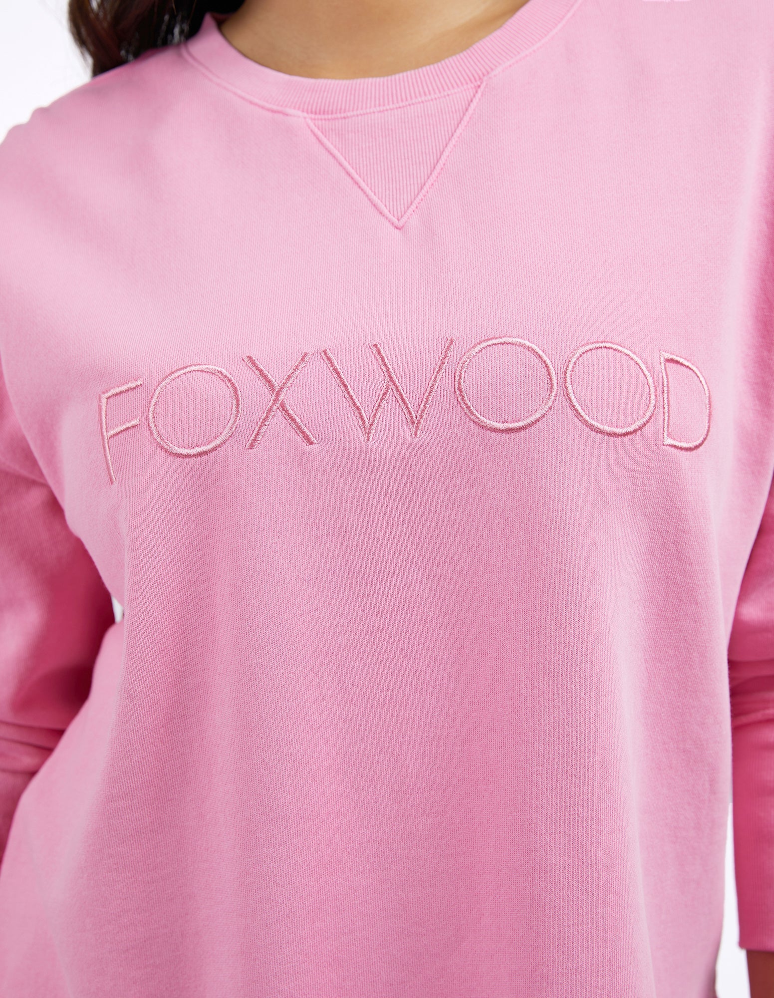 Foxwood Simplified Crew Bubblegum Pink sweater showing a close-up of the soft knit fabric and vibrant pink color.