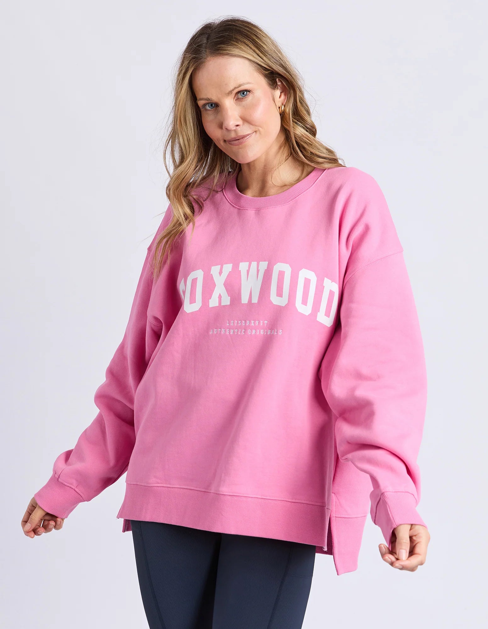 Foxwood Interval Crew in Bubblegum Pink, close-up of soft, cozy knit fabric showcasing vibrant pink color and comfortable fit.