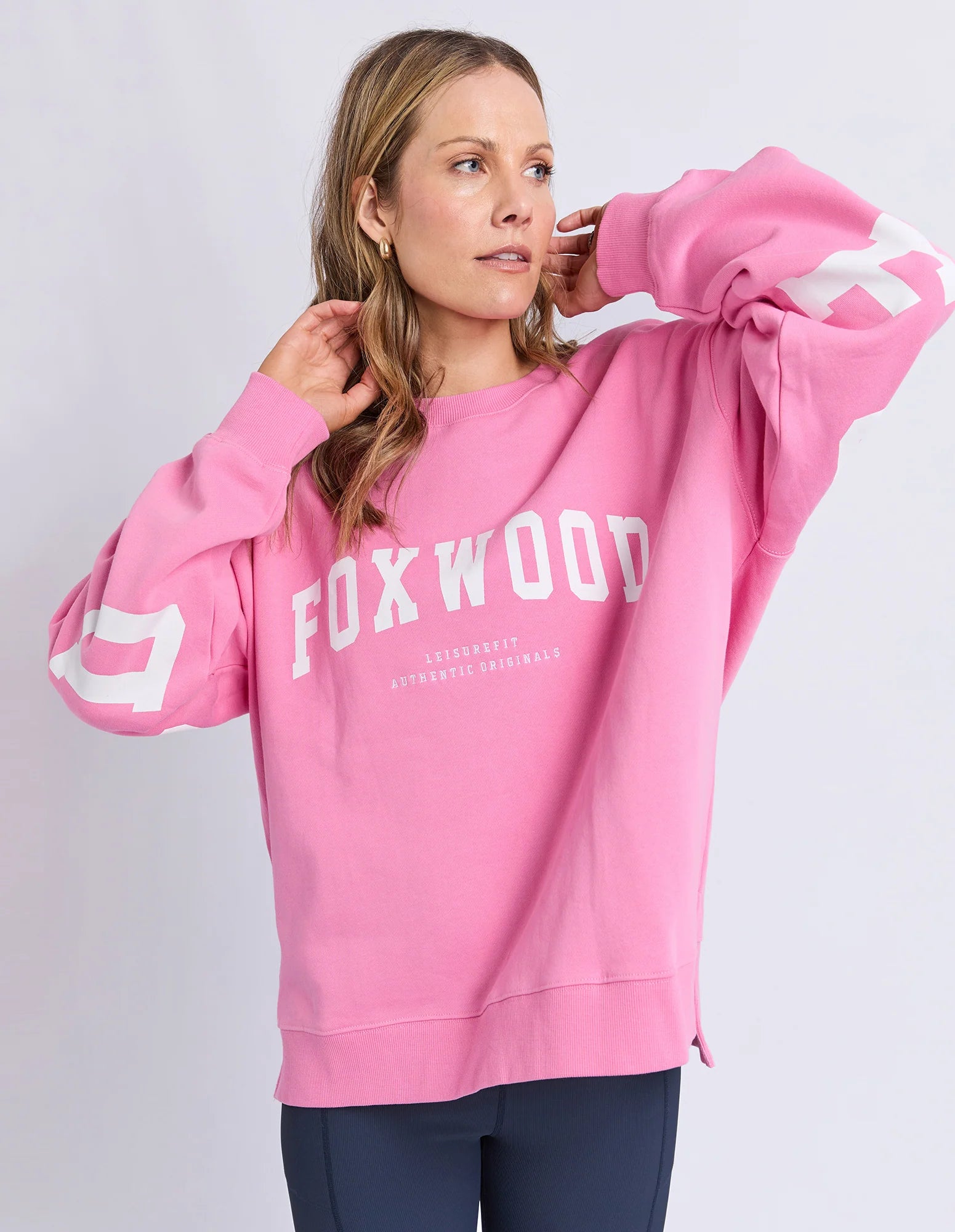 Foxwood Interval Crew Bubblegum Pink sweater displayed flat, showing soft fabric and vibrant pink color.