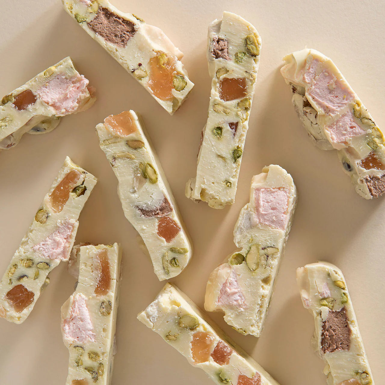 White Choc Rocky Road by New Farm, 200g, showcasing a close-up of the chocolate treat with marshmallows, nuts, and dried fruits.
