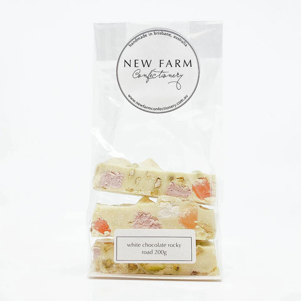 White Choc Rocky Road by New Farm, showing a close-up of the 200g white chocolate rocky road with nuts and marshmallows.