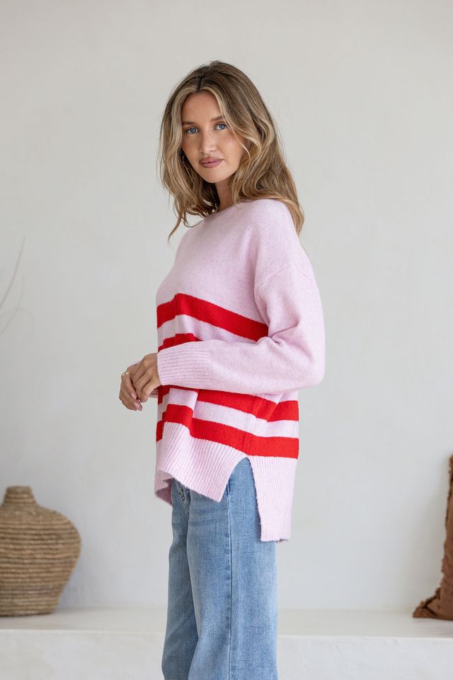 Pink and red striped knit jumper from Miss Marlow, featuring a cozy, stylish sweater with a classic stripe pattern.