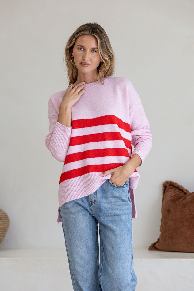 Pink and red stripe knit jumper by Miss Marlow, showing close-up of soft, cozy fabric and stylish striped pattern.