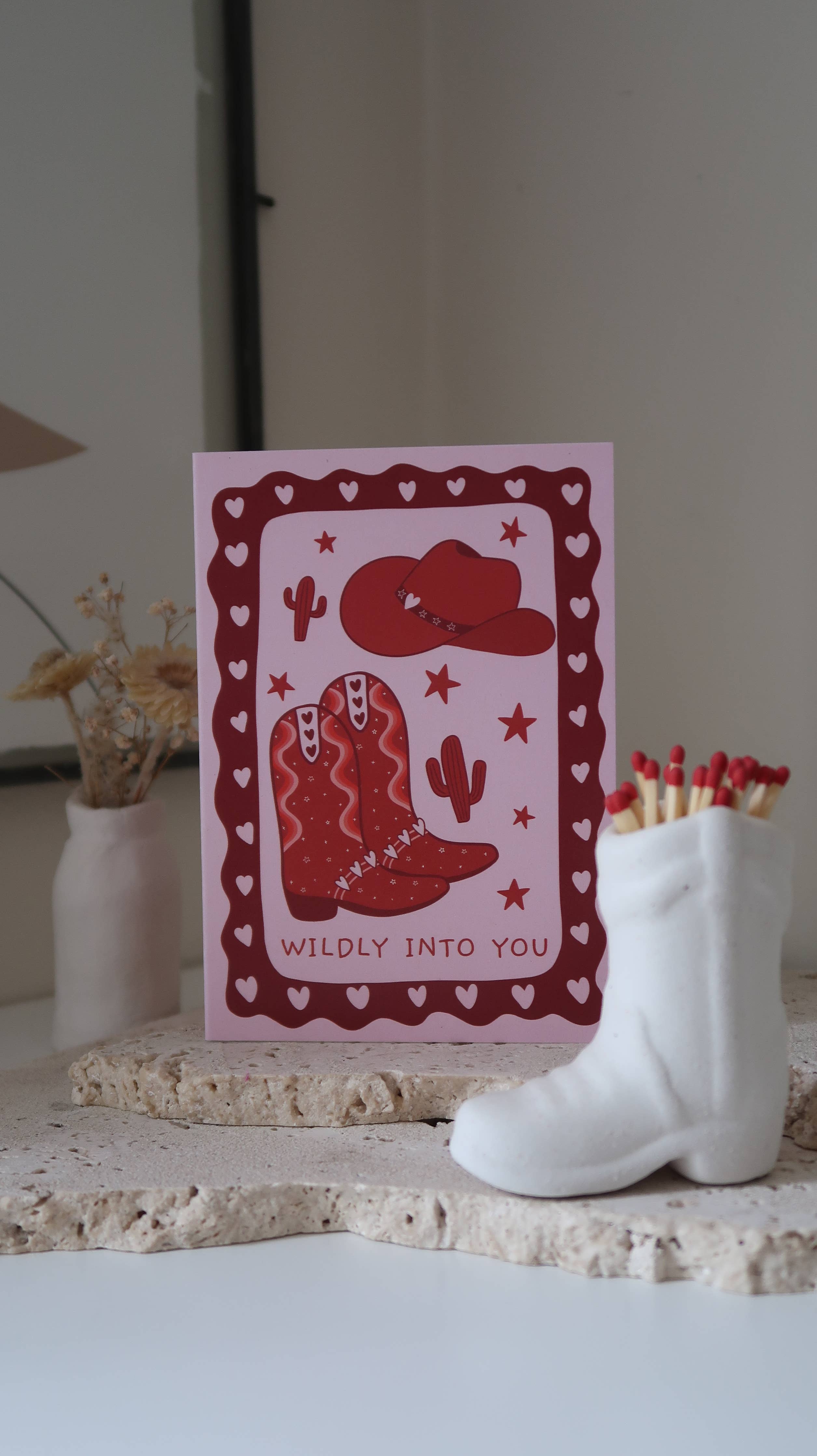 Valentine's Day card featuring a cowboy boot with "Wildly Into You" love message, from Rosalie, with romantic design and heartfelt details.
