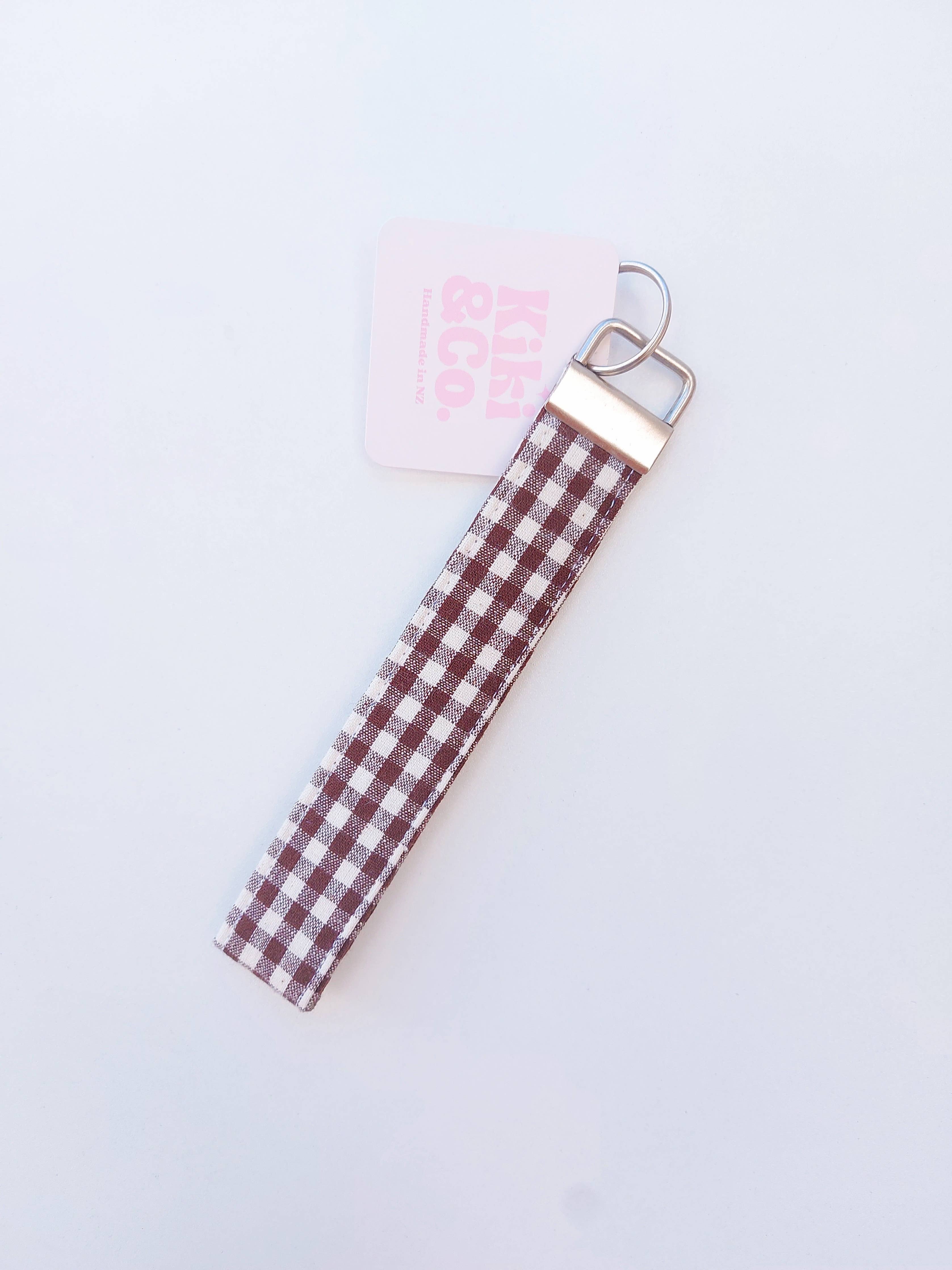 Chocolate Gingham keychain by Kiki & Co. featuring a fabric-covered charm with a classic gingham pattern and metal keyring.