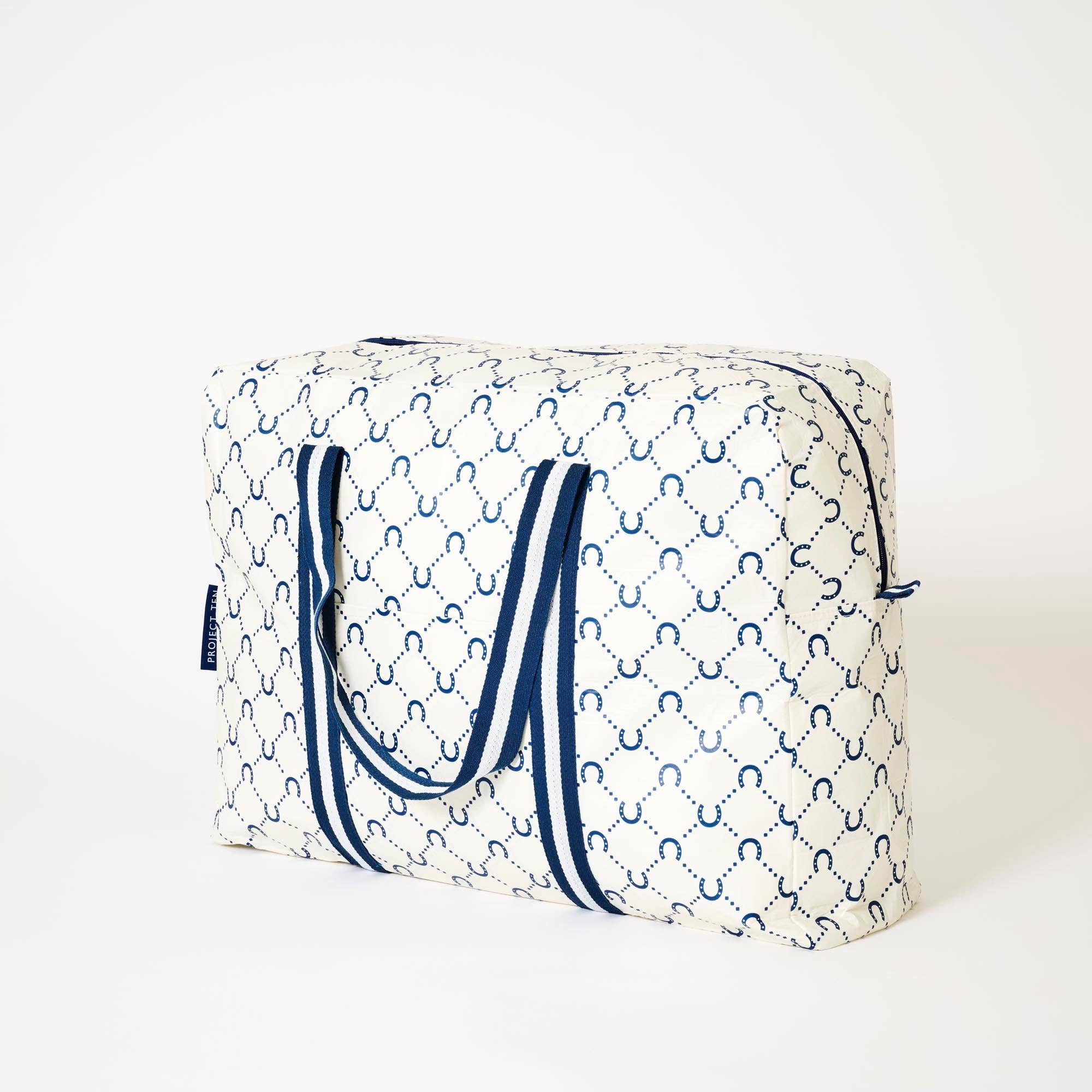 Navy horseshoe overnight bag by Project Ten Pty Ltd with sturdy handles and spacious interior for travel essentials.