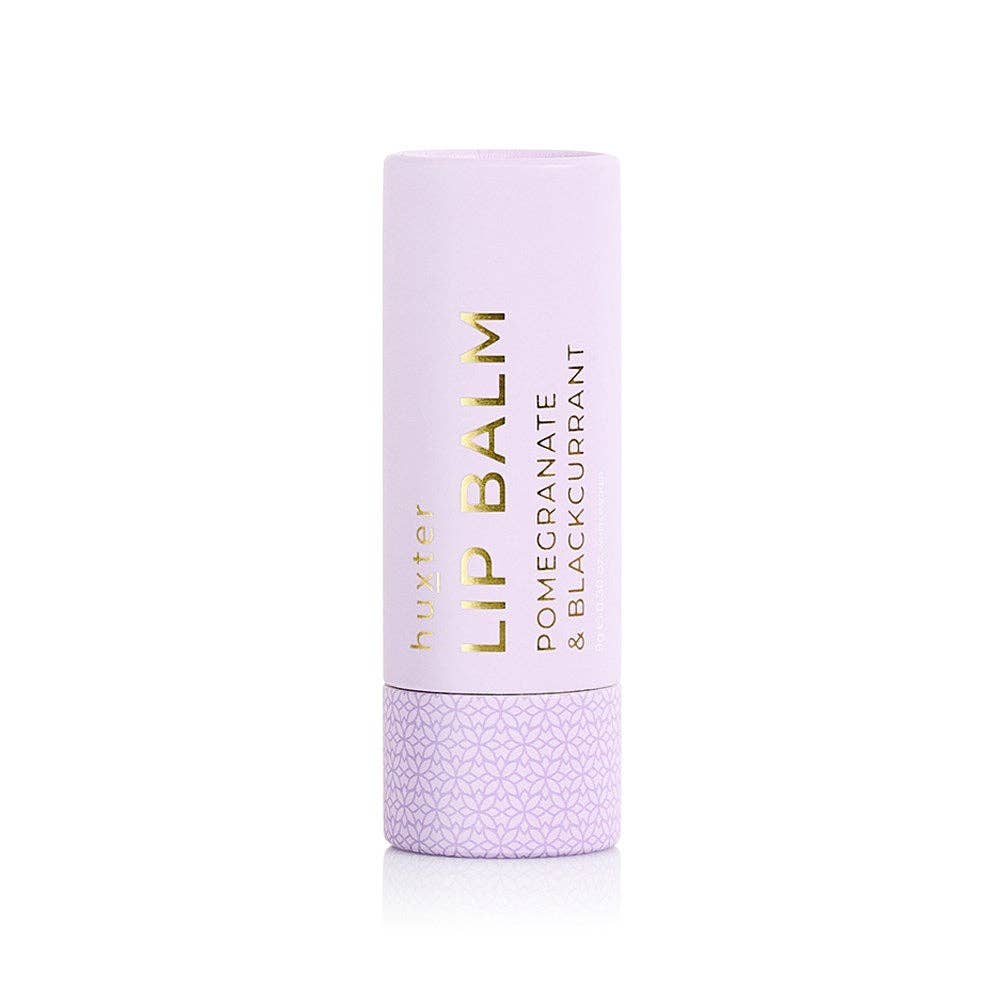 Huxter pomegranate and blackcurrant lip balm in mauve color, 9g tin with smooth balm visible inside.